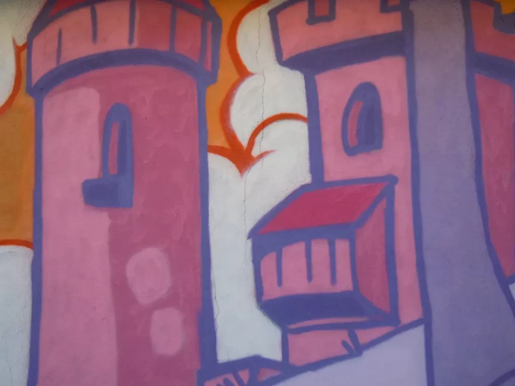 Photo qui montre en gros plan les détails du château en arrière plan de la fresque.